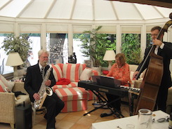 The Abbey Jazz Trio (saxophone, piano and double bass), performing at a birthday party in a conservatory