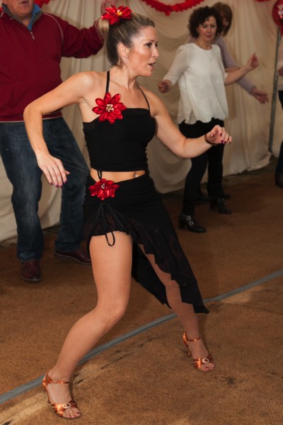 Salsa Dancer Leanne Teaching Guests at a party while our live salsa band plays